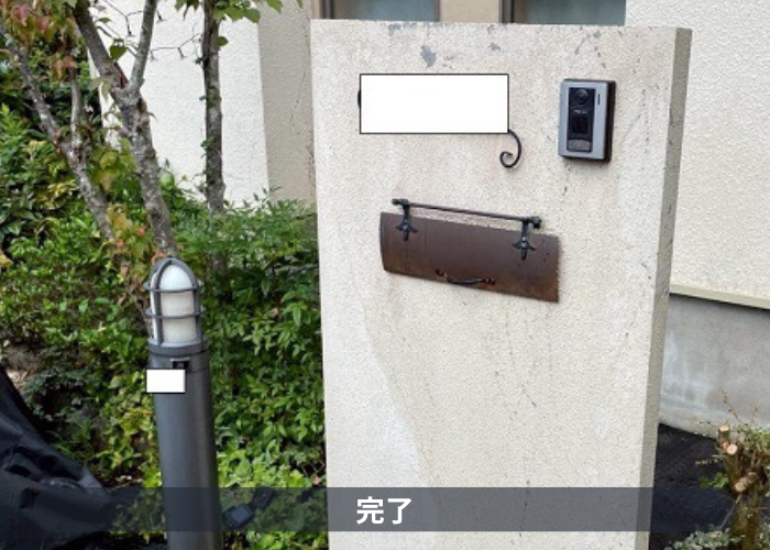 川西市で汚れや剥がれが発生している擁壁の塗装工事を行った後の様子